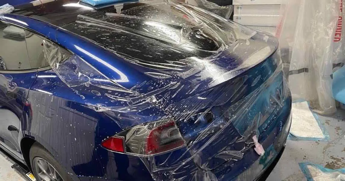 Paint protection film installation shown on the Deluxe company website